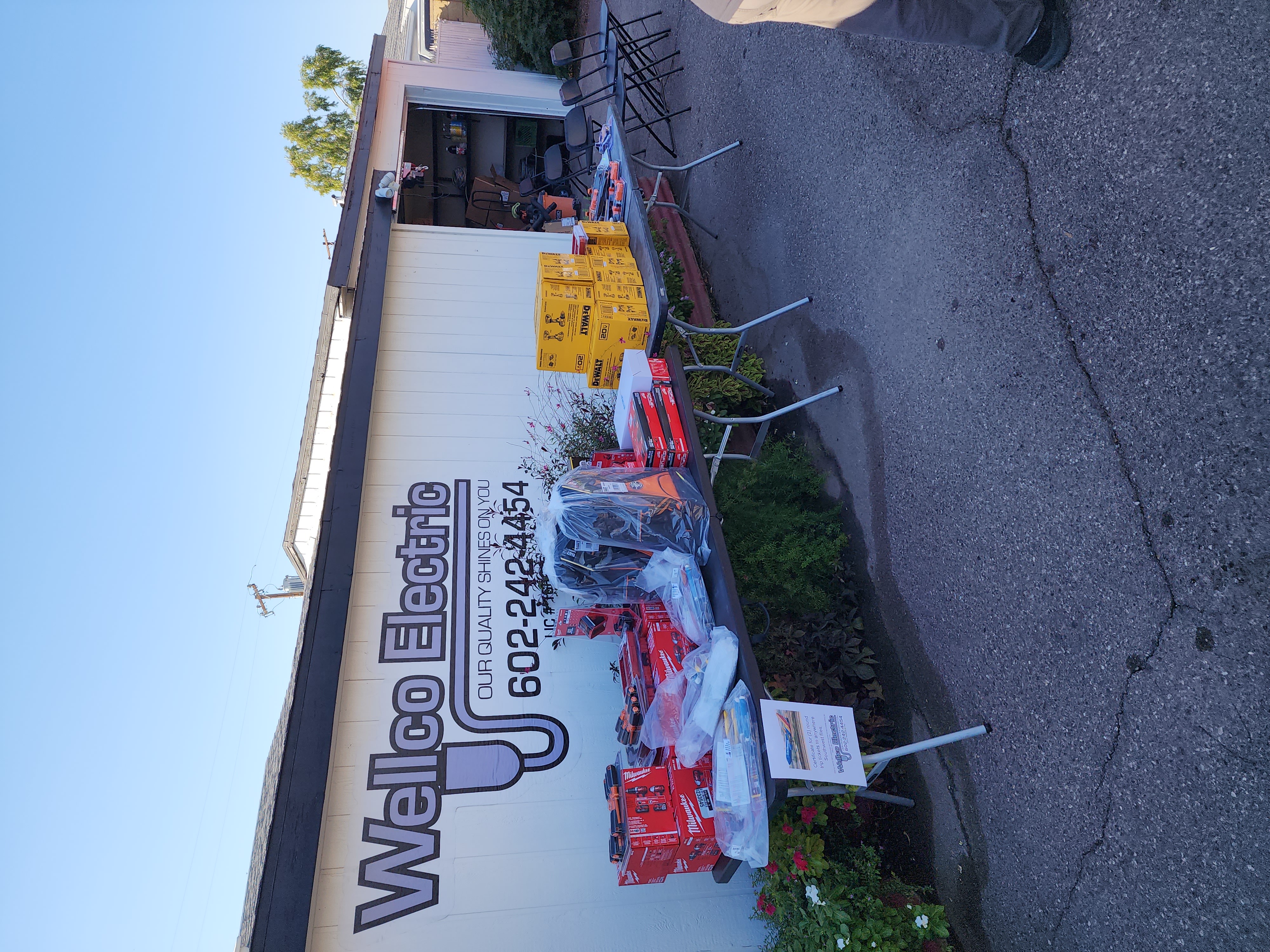 Wellco Electric team event outside the company building
